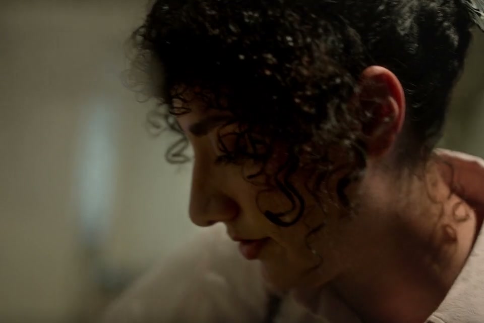 A chef framed by steam while preparing dinner