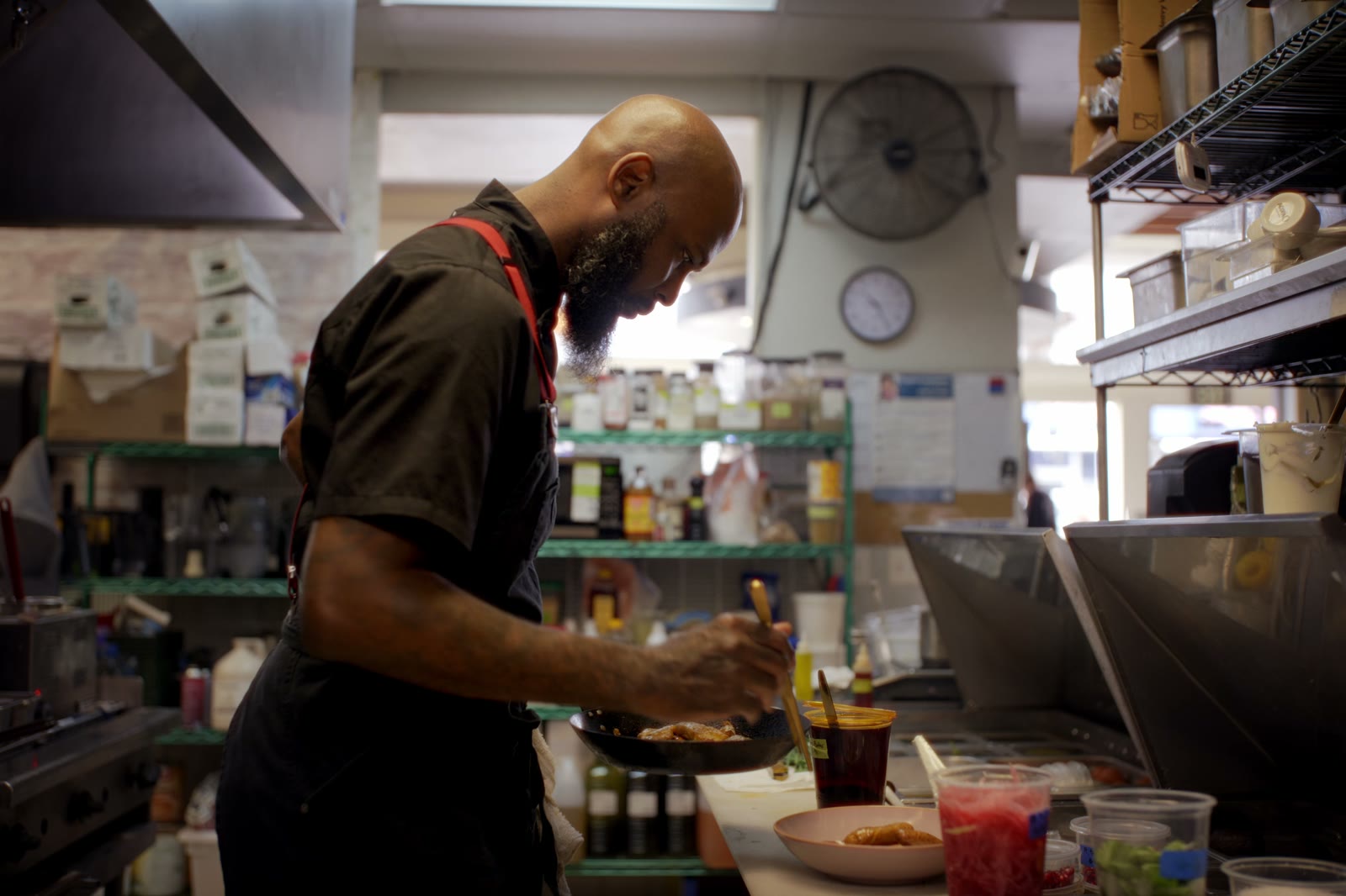 Kitchens for Good participant preparing food in a commercial kitchen