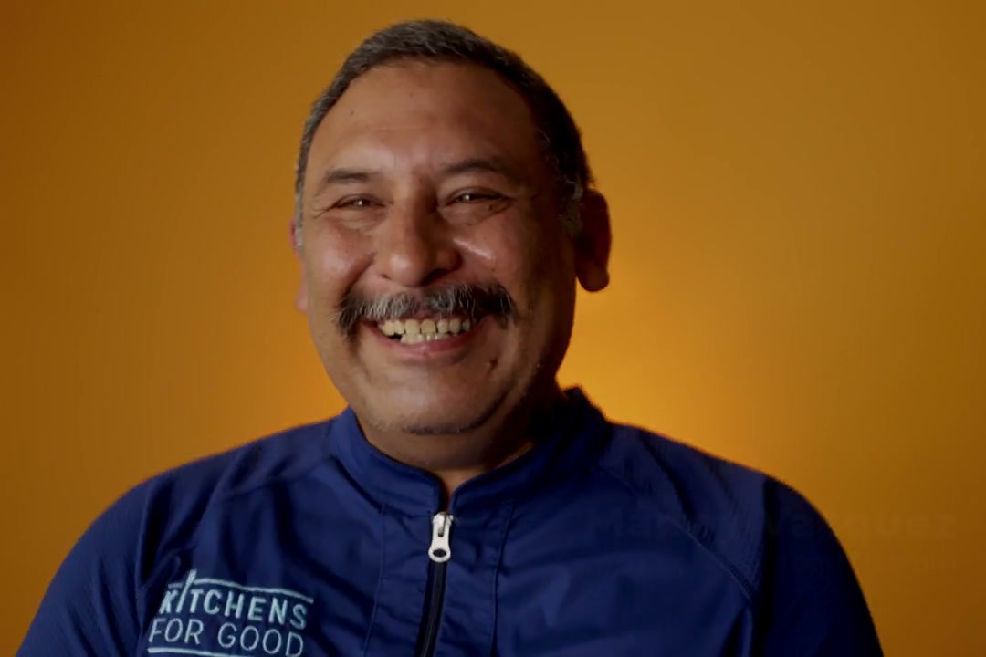 Manny Vasquez smiling during his Kitchens for Good interview